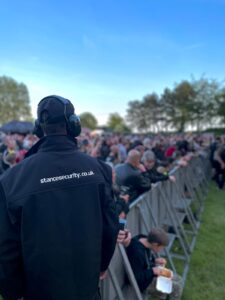 Door supervisor over seeing the pit at a festival